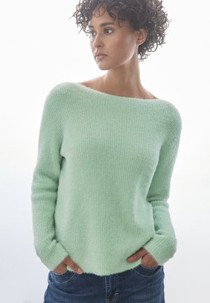 Maglione verde menta con una vestibilità comoda, scollatura a spalle scoperte, maniche lunghe e un morbido tessuto a maglia testurizzato. Presenta tasche frontali.