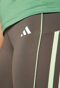 adidas Performance HYPERGLAM - Tajice - shadow olive/green spark