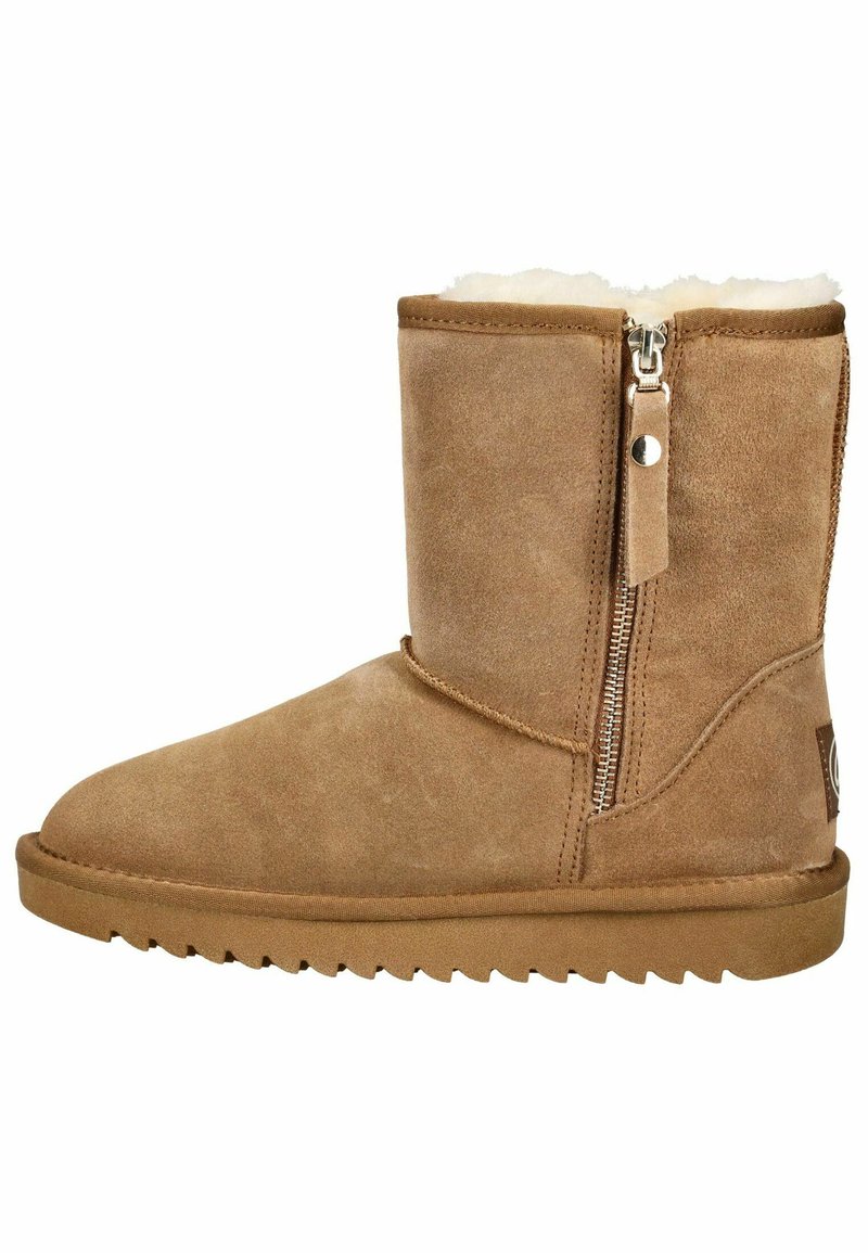 Stivale alla caviglia in suede beige con zip laterale, rivestimento in morbido pelliccia, punta arrotondata e suola in gomma testurizzata con motivo a zigzag.