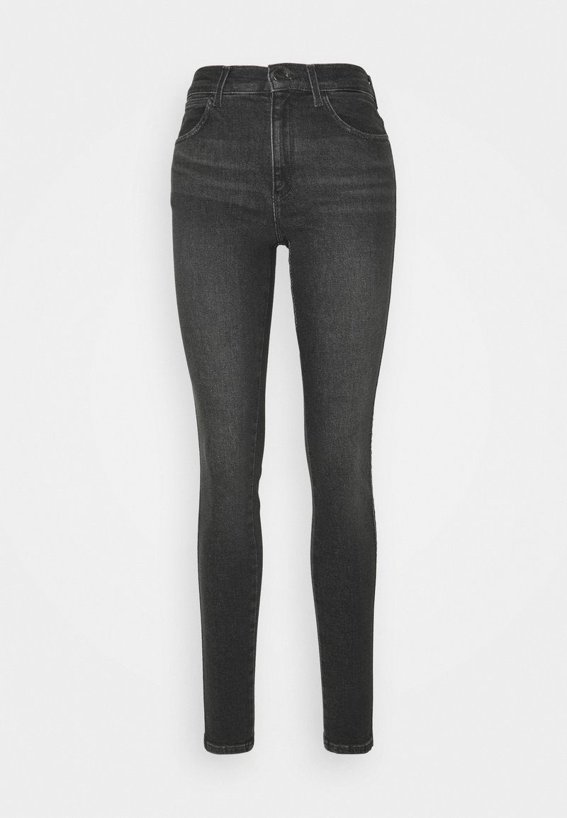 Jeans skinnies negros de denim con cintura alta. Cuenta con cinco bolsillos, pasadores para cinturón y detalles de costura mínimos. Textura suave.