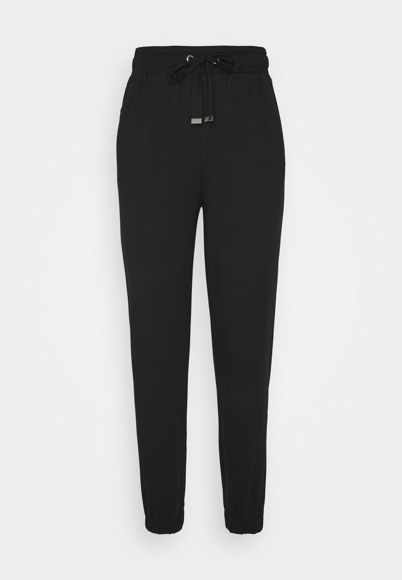 Schwarze Jogginghosen aus weichem Material, mit einem elastischen Bund und Kordelzug sowie schmalen Bündchen an den Knöcheln.