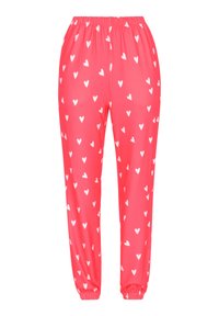 Roze joggingbroek van lichtgewicht stof, met een wit hartpatroon, een elastische tailleband en elastische boorden bij de enkels.