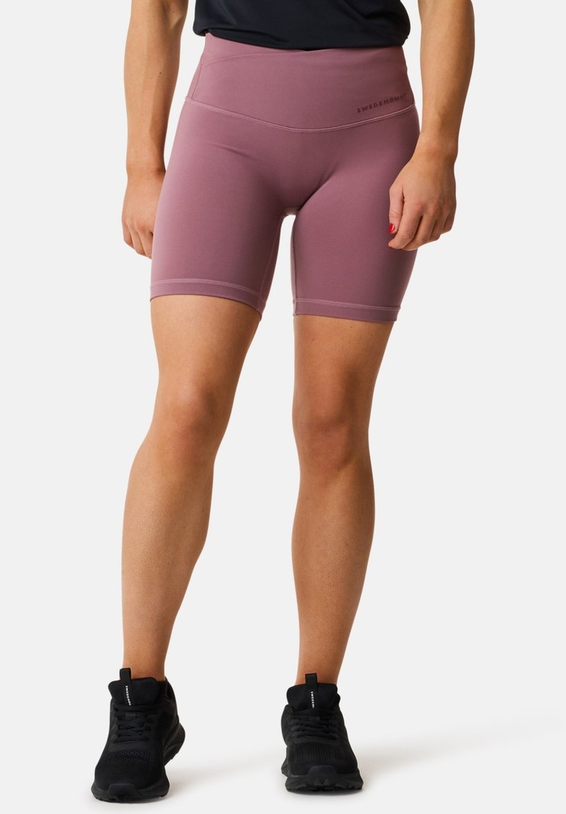 Rosa Sportshorts, hoch tailliert, aus dehnbarem Material. Merkmale: glatte Textur und Nahtdetails für Komfort und Unterstützung.