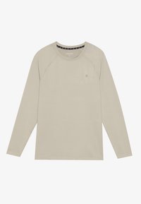 Ilgi piedurkņu bēšs T-krekls ar noapaļotu kakla izgriezumu un raglan piedurknēm. Uz krūšu ir neliels logotips un tas ir izgatavots no gludas, vieglas auduma.