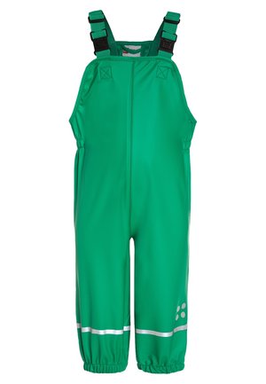Pantalon salopette imperméable vert avec bretelles réglables à boucle noire, poignets élastiques et bandes réfléchissantes près des chevilles.