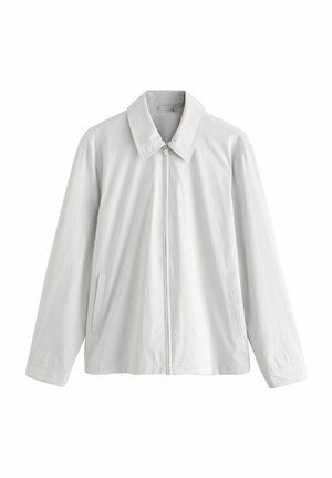 Lightweight white jacket with a collared neck, front zipper closure, and two side pockets. Features a smooth texture and relaxed fit.