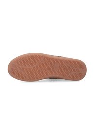 Schuhsohle aus strukturiertem Gummi mit einem Wabenmuster in hellbrauner Farbe. Flaches Design für Stabilität.