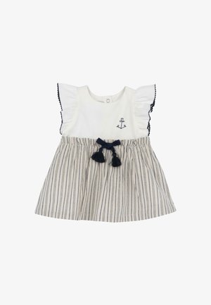 Weißes Oberteil mit marineblauen Rüschenärmeln, mit Ankerstickerei. Gestreifter Rock mit dunkelblauer Schleife und Quasten. Baumwollmaterial.