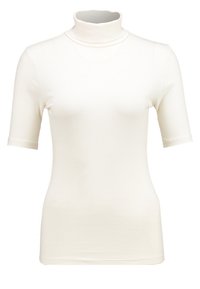 Top bianco a collo alto a coste con maniche corte, caratterizzato da una silhouette aderente e una texture liscia. Nessun logo o motivo visibile.