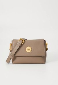 Tan leather crossbody bag with a textured finish, featuring a gold-tone circular clasp and adjustable strap. Compact rectangular design.
