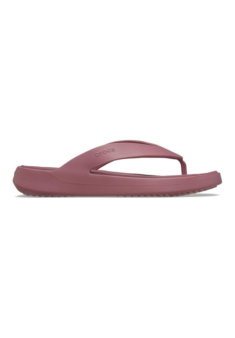 Chancleta de goma morada con un diseño elegante, que presenta una tira en forma de Y y una suela texturizada para mayor agarre. Material ligero y flexible.
