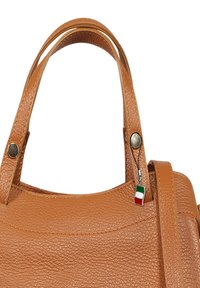 Brown leather handbag with textured surface, two sturdy handles, and a small Italian flag charm attached to the hardware.