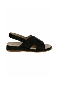 Černé kožené sandály na pata s křížovým designem, plochou béžovou stélkou a gumovou podrážkou s mírným podpatkem.