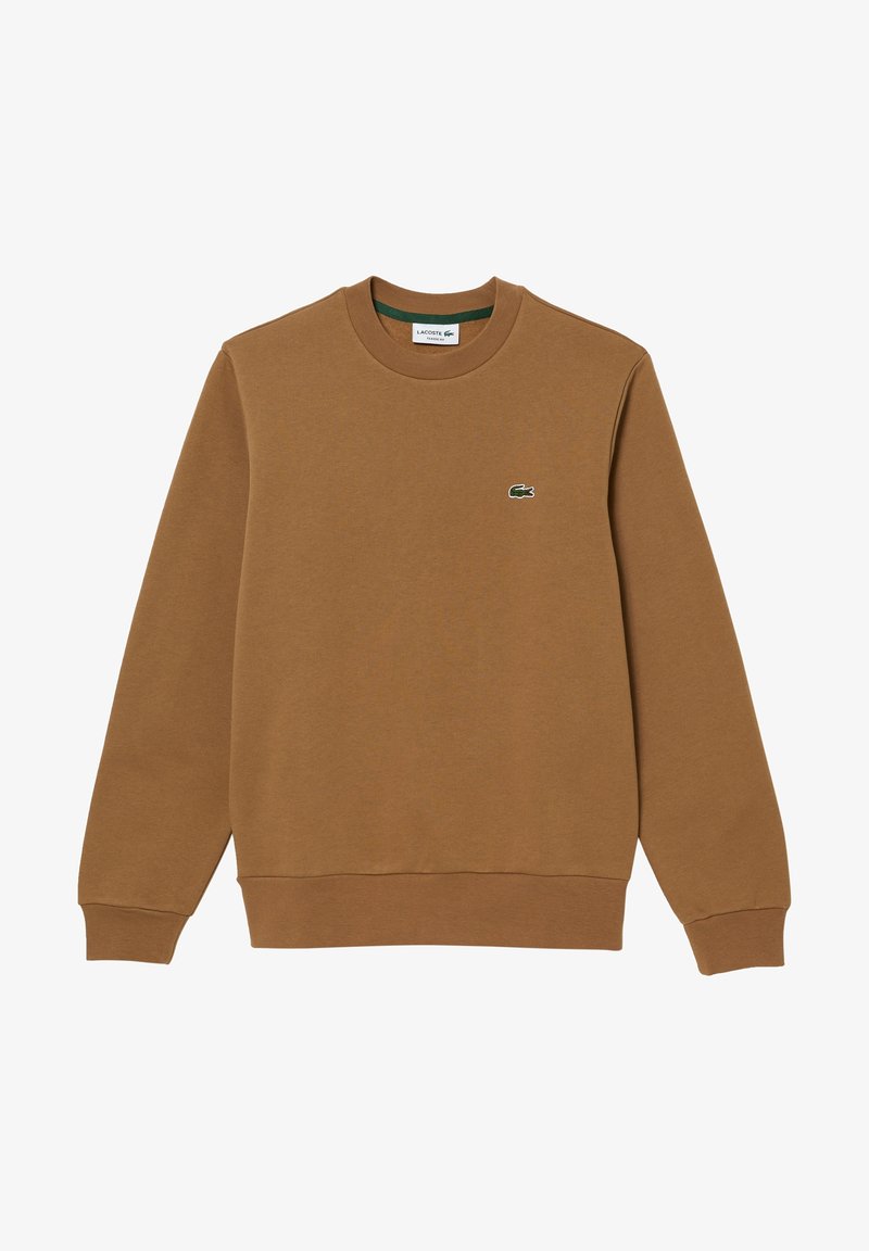 Sweat-shirt en coton marron avec un col rond, des poignets côtelés et un petit logo Lacoste vert sur la poitrine. Texture lisse et coupe décontractée.