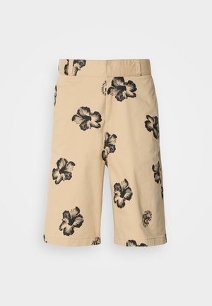 Bež hlače s črnim vzorcem hibiskusa. Imajo elastičen pas in podrobnost z logotipom na spodnji strani. Narejene so iz lahkega materiala.
