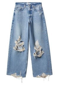 Jean en denim bleu clair avec taille haute, coupe évasée, présentant de grands patchs distendus et des ourlets effilochés. Pas de poches arrière visibles.