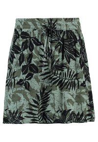 Jupe verte à motifs avec une taille à cordon, fabriquée en tissu léger avec des feuilles tropicales noires et des motifs camouflage.