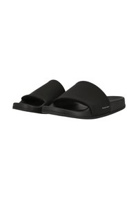 Black slide sandals with a smooth, matte finish. Features a wide upper band and a textured footbed. Simple, minimalist design with visible branding.