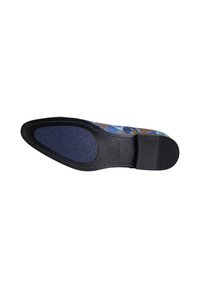 Shoe sole with a black rubber base, featuring a textured blue upper with floral patterns in blue and brown. Stamped logo and size visible.