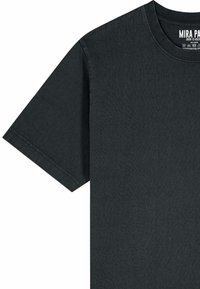 Black short-sleeve crewneck T-shirt with visible stitching and printed white label inside the neck area.