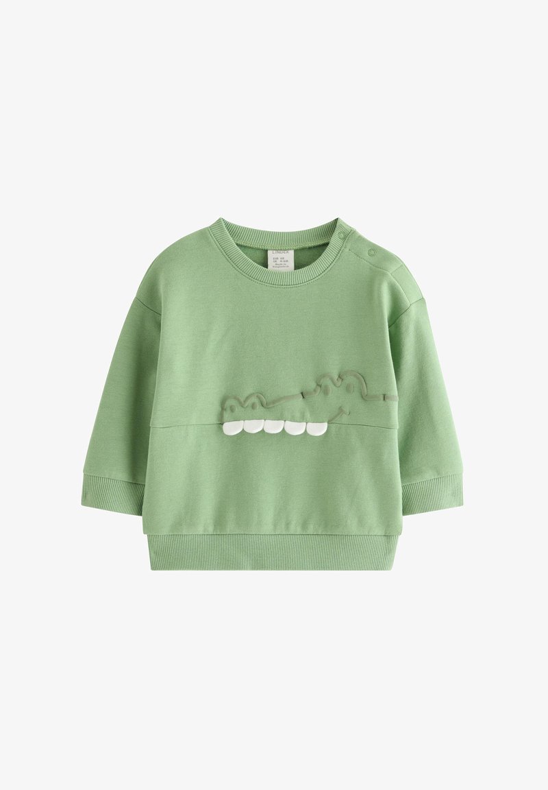 Πράσινο βαμβακερό φούτερ με στρογγυλή λαιμόκοψη, μακριά μανίκια και υφή κροκοδείλου με λευκές λεπτομέρειες στα δόντια.