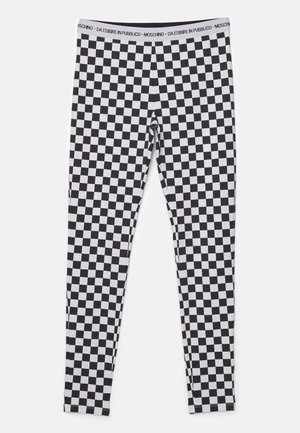 Leggings a scacchi bianchi e neri realizzati in un tessuto elasticizzato. Presentano una cintura ampia con il testo del marchio e un design aderente in tutto il capo.