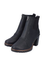 Botas negras de tobillo hechas de cuero con cremalleras y paneles laterales elásticos, con un tacón grueso y una suela de goma texturizada.