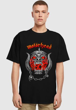 Black cotton t-shirt featuring a graphic design of a skull and horns in silver, red flames, and the word "Motörhead" in orange.