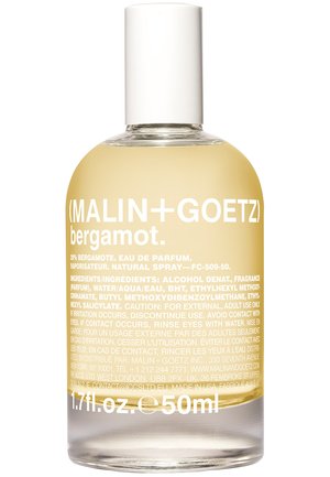 Clear glass bottle with a rounded shape, filled with pale yellow liquid. White cap and bold white text detailing product information.