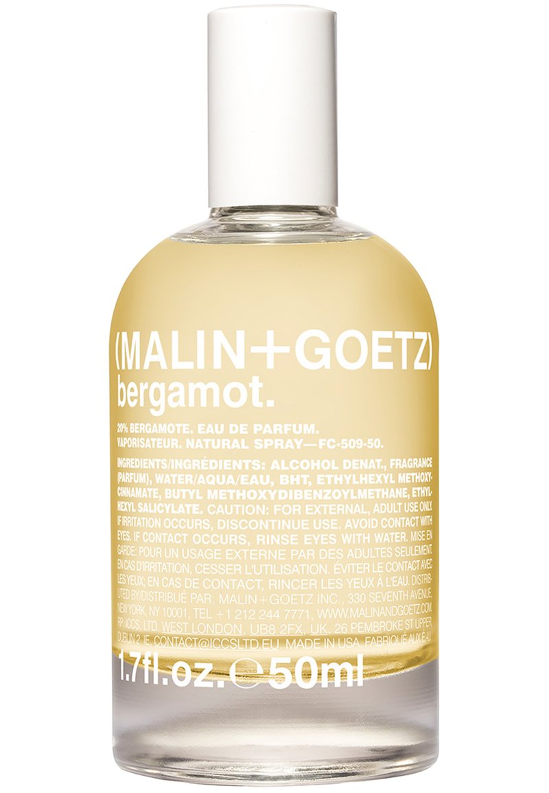 Durchsichtige Glasflasche mit runder Form, gefüllt mit einem blassgelben Flüssigkeit. Weißer Deckel und fettgedruckter weißer Text mit Produktinformationen.