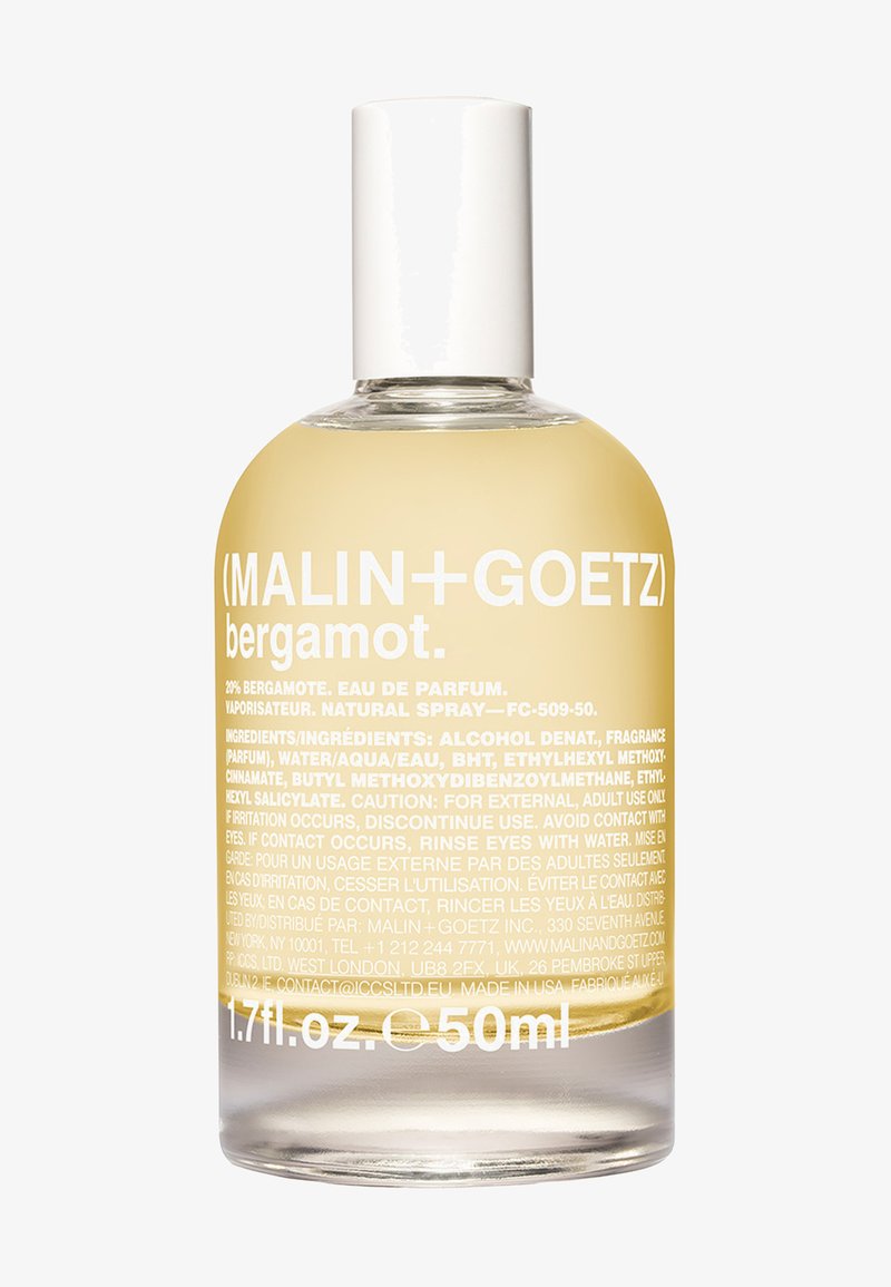 Durchsichtige Glasflasche mit runder Form, gefüllt mit einem blassgelben Flüssigkeit. Weißer Deckel und fettgedruckter weißer Text mit Produktinformationen.