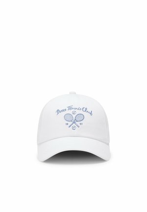 White baseball cap with blue embroidered crossed tennis rackets, three tennis balls, and text "Boss Tennis Club 1997" on front panel.