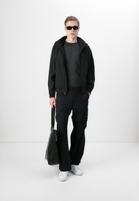 Calvin Klein Vodotesná bunda - black