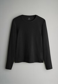 Must have mustris varrukatega must särk, valmistatud ribakujulisest kangast. Ümar kaelus ja sirge hem, külgedel lõhikud. Lihtne, minimalistlik disain.