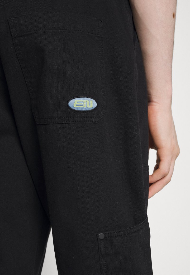 Herren Chinos | Endless Nights CARPENTER PANT UNISEX Cargohose black/schwarz - TU35438 Herren Chinos | Endless Nights CARPENTER PANT UNISEX Cargohose black/schwarz - TU35438