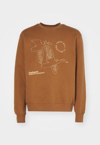 Sudadera de algodón marrón con cuello redondo y puños de canalé. Presenta un gráfico blanco de pájaros y el texto "DE MOLINO A MILLONES" en la parte frontal.