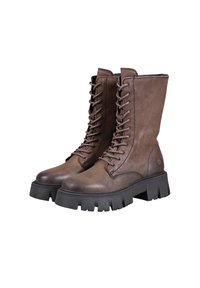 Brown leather ankle boots with a rounded toe, lace-up front, and chunky black rubber sole featuring deep grooves for traction.