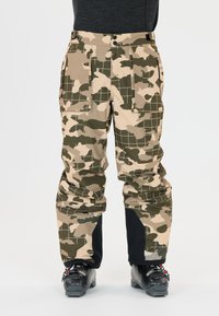 Camouflage skibroek in beige en groen met een ruitpatroon, voorzien van meerdere zakken en een zwarte accenten bij de boorden.