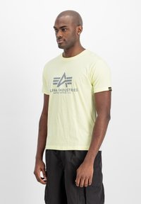 Alpha Industries Triko s potiskem - retro yellow