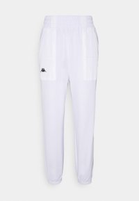 Vita idrottsbyxor tillverkade av ett glatt tyg, med elastisk midja, två sidofickor och en liten svart logotypdetalj fram.