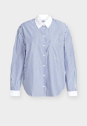 Sininen ja valkoinen puuvillainen raidallinen paita. Edessä napillinen suljenta, pitkät hihat ja valkoinen kaulus. Mukana rintatasku.