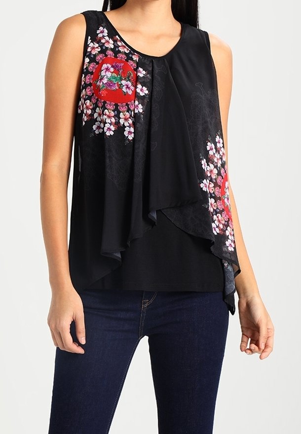 Haut noir sans manches présentant des motifs floraux en rose et blanc, design en couches avec tissu drapé et texture lisse.