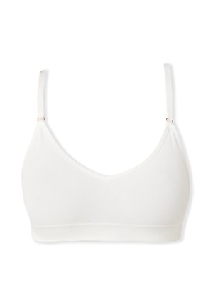 Bralette bianco con un design morbido e senza cuciture, spalline regolabili e un'ampia fascia a costine nella parte inferiore. Senza imbottitura né stecche.