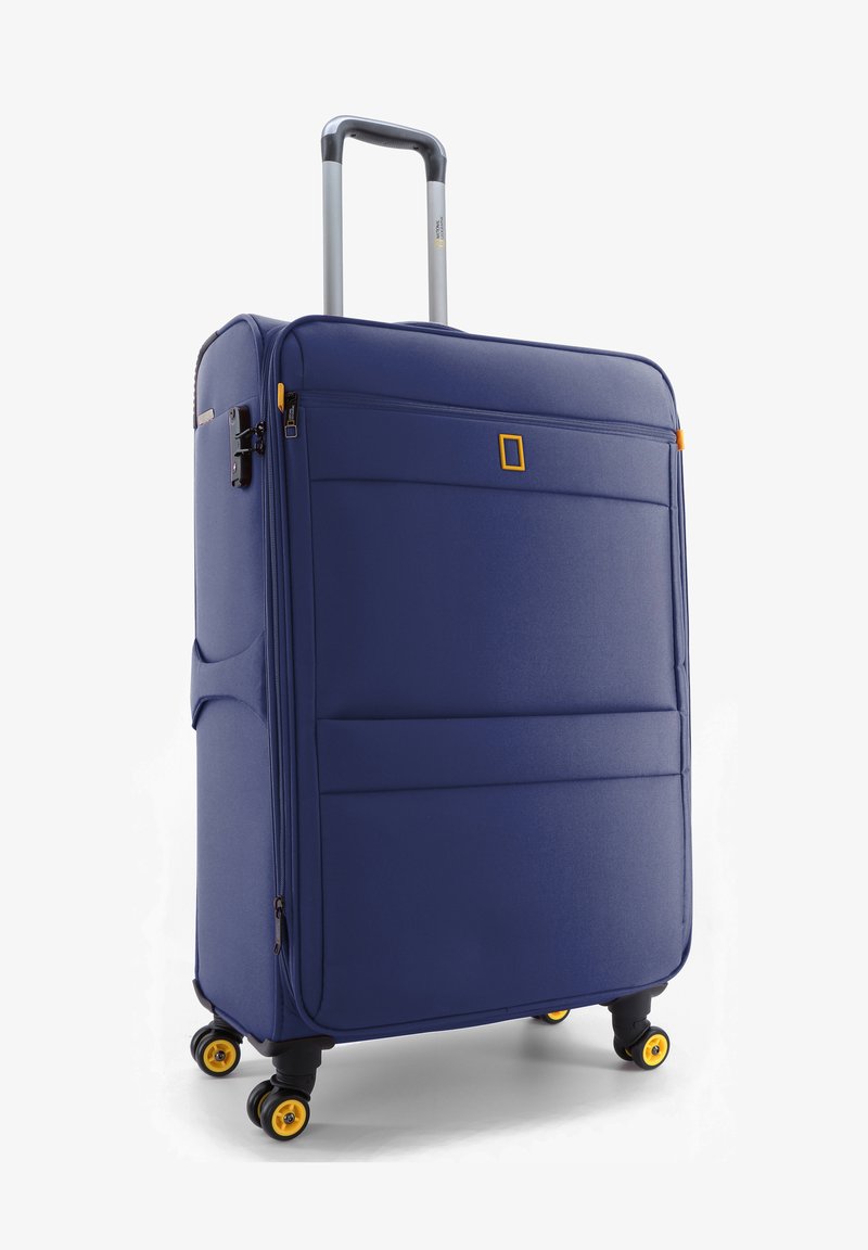 Navy blue soft-sided suitcase with smooth texture, retractable handle, front zipper pocket, and black wheels with yellow accents.