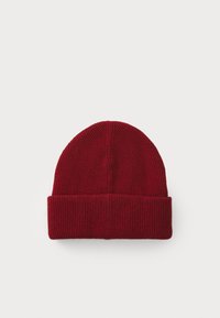 Red knit beanie with a ribbed texture, featuring a folded cuff and a rounded crown, made of soft, warm material.