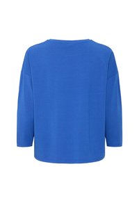 Sinine puuvillane pluus ümarate kaelustega ja kolmeveerand pikkade varrukatega. Sile tekstuur, lõdva istuvusega ja kumer hemline seljaosas.