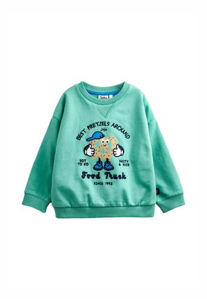 Kindersweater in muntgroen met een cartoontje van een pretzel met blauwe schoenen en hoed, tekst over beste pretzels en foodtruck.