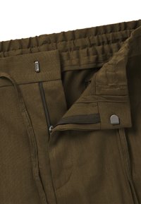 Olive green pants featuring a zipper closure, elastic waistband, smooth texture, and a subtle sheen; includes metal hardware accents.