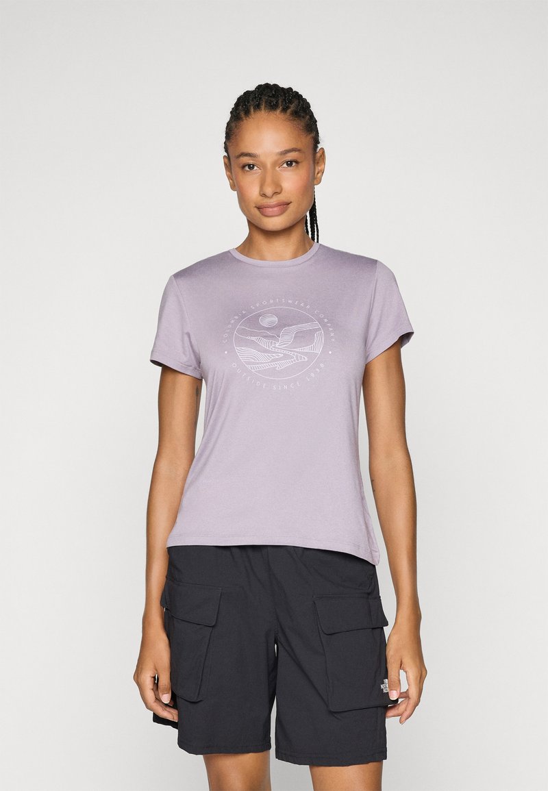 Purple short-sleeve t-shirt features a circular graphic print in white. Paired with black cargo shorts, showcasing functional side pockets.
