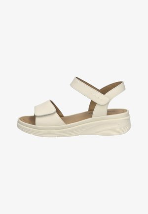 White leather sandal featuring a closed toe and two adjustable cross-straps. The lightweight sole has a textured design for added grip.